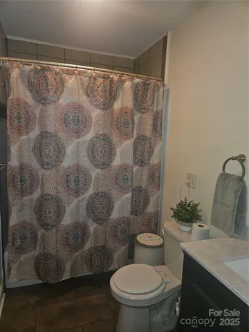 a bed room with a bed and a television