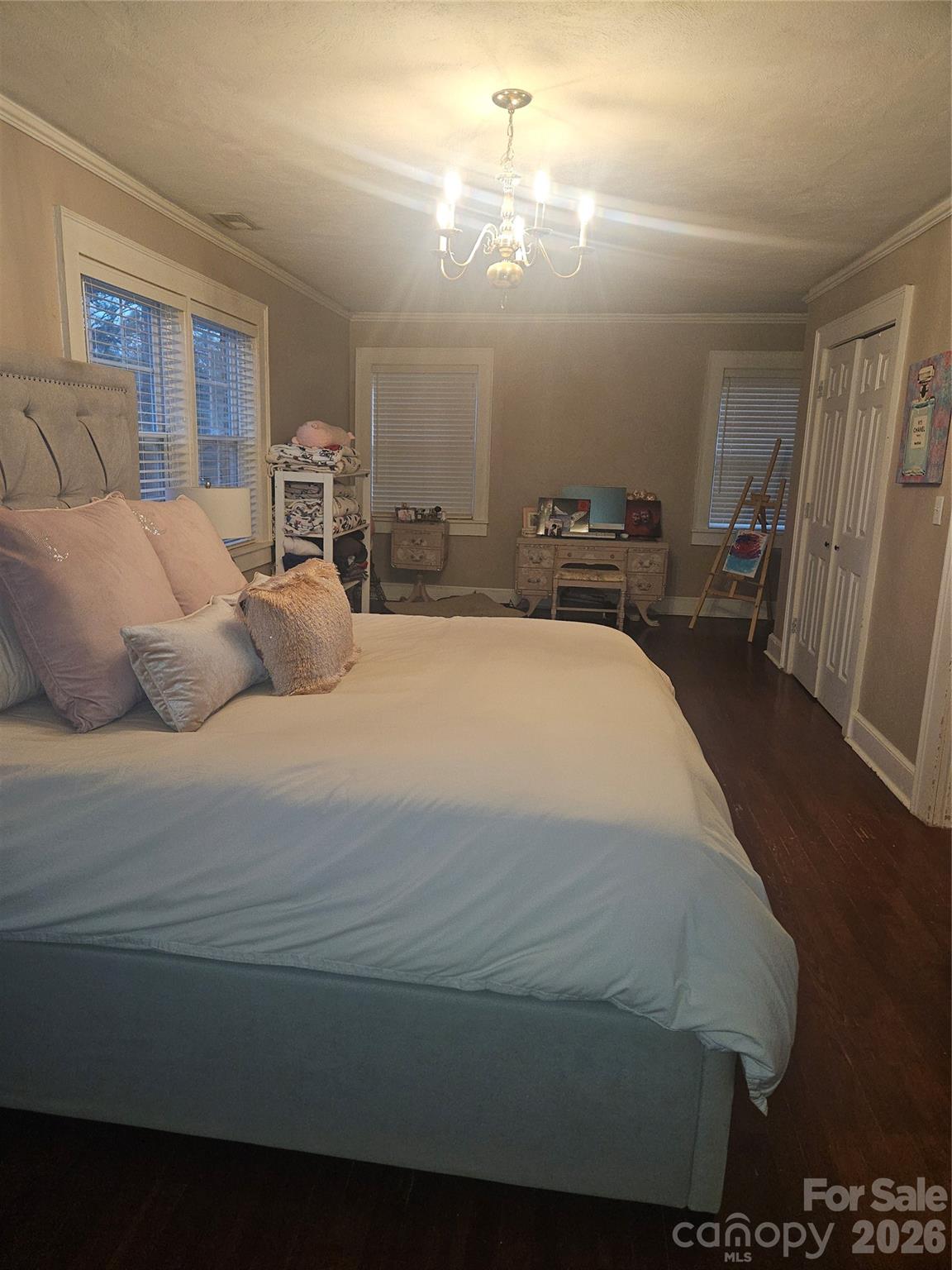 313 Mountain Creek Road Albemarle, NC 28001 - Photo 21 of 23 a large bed sitting in a spacious bedroom and kitchen
