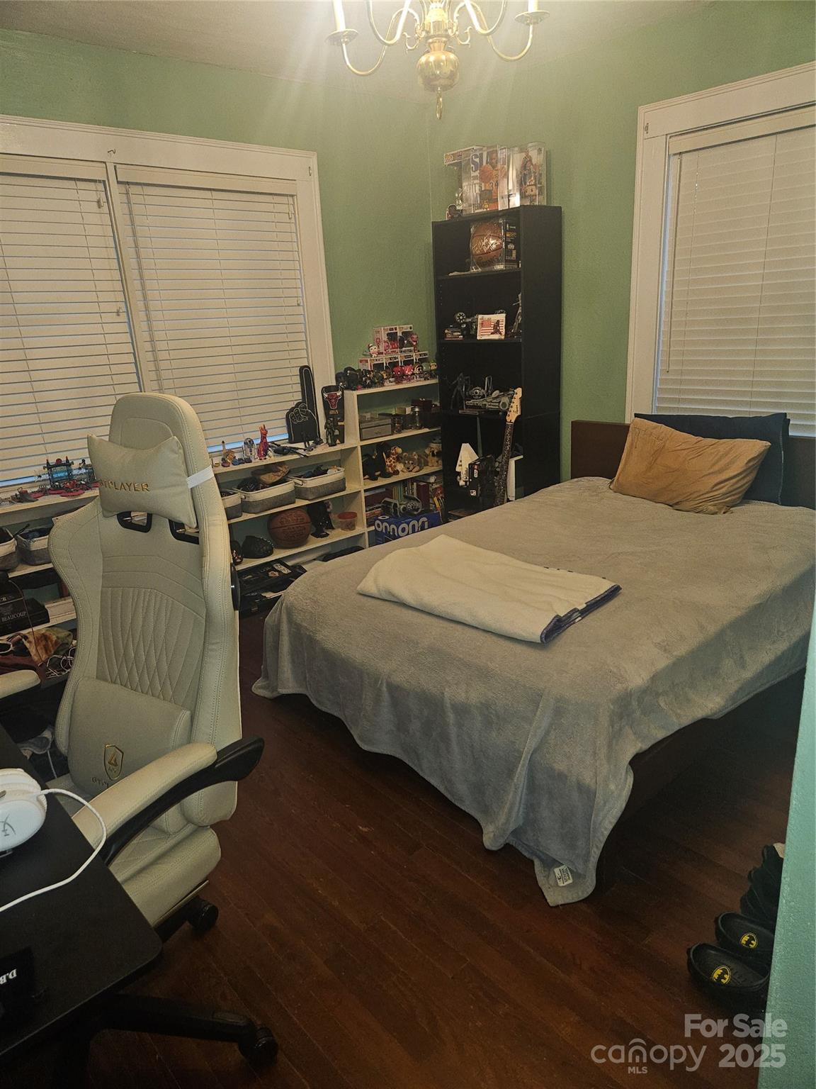 313 Mountain Creek Road Albemarle, NC 28001 - Photo 23 of 25 a bedroom with a bed and wooden floor