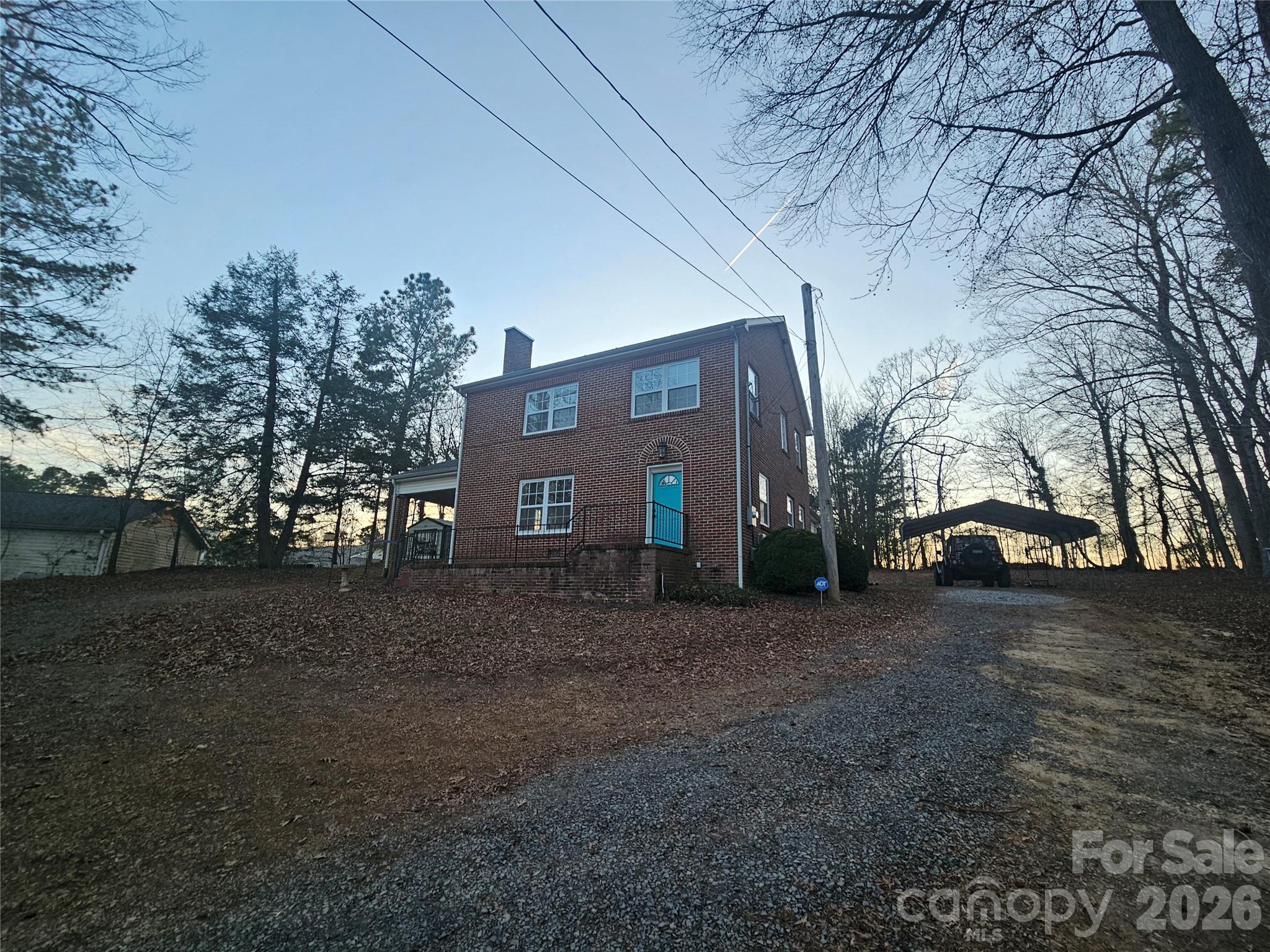313 Mountain Creek Road Albemarle, NC 28001 - Photo 3 of 23 a view of a house with a yard