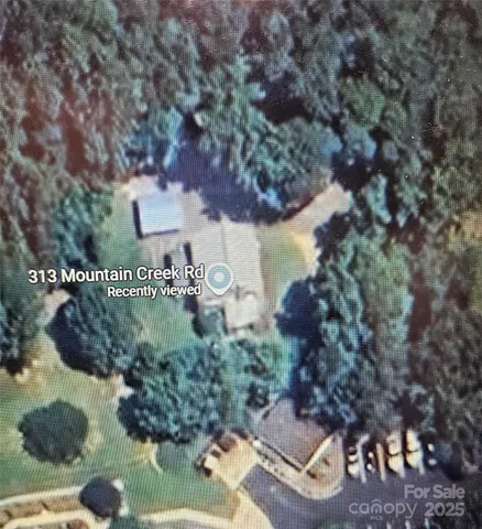 a view of a tree in front of house