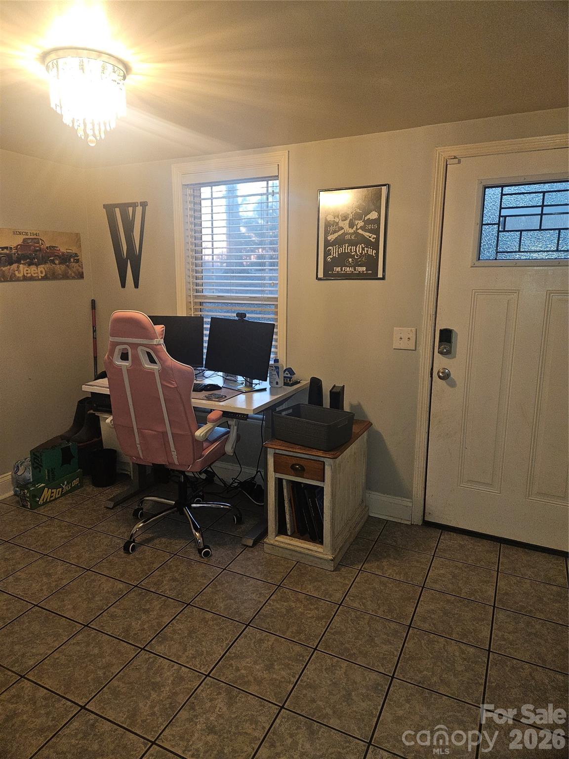 313 Mountain Creek Road Albemarle, NC 28001 - Photo 7 of 23 a view of a workspace with furniture and a window