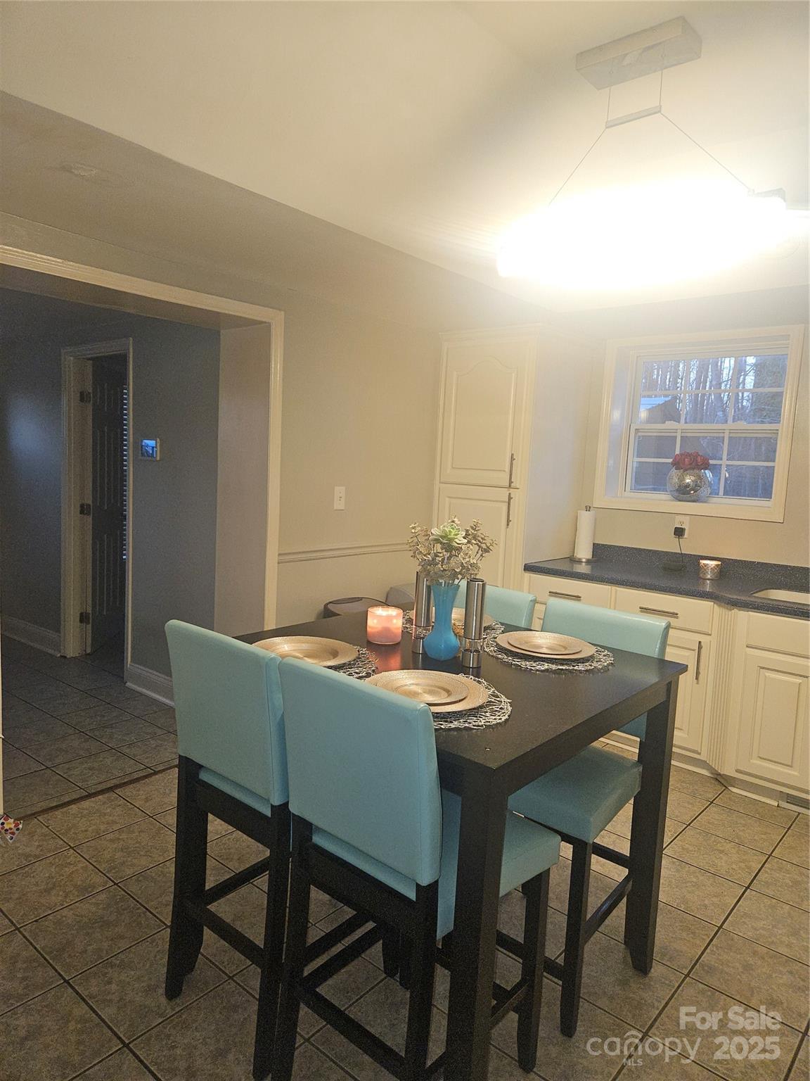313 Mountain Creek Road Albemarle, NC 28001 - Photo 10 of 25 a view of a dining room with furniture
