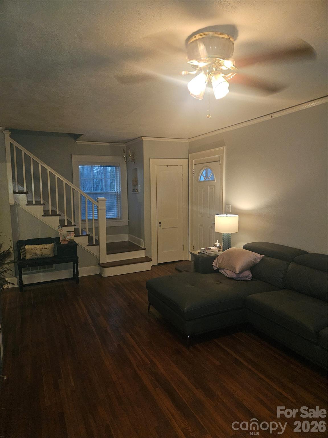 313 Mountain Creek Road Albemarle, NC 28001 - Photo 10 of 23 a spacious bedroom with a bed and a chandelier