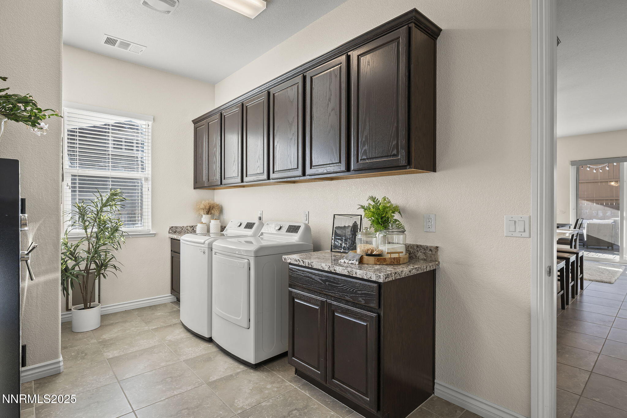 425 Chelmsford Drive Reno, NV 89439 - Photo 26 of 36 a utility room with cabinets washer and dryer