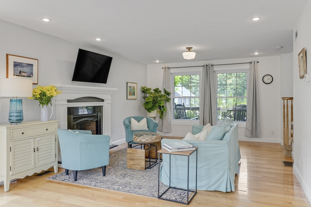 128-136 Spring Street Tisbury, MA 02568 - Photo 15 of 42 a living room with fireplace furniture and a flat screen tv
