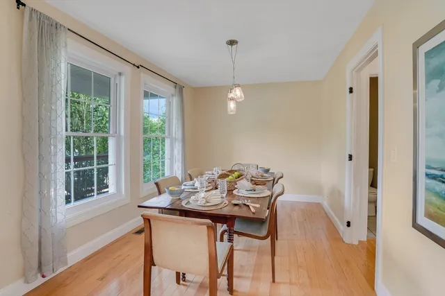 a dining room with furniture window wooden floor