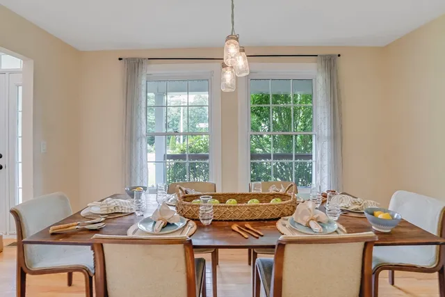 a view of a dining room with furniture window and outside view