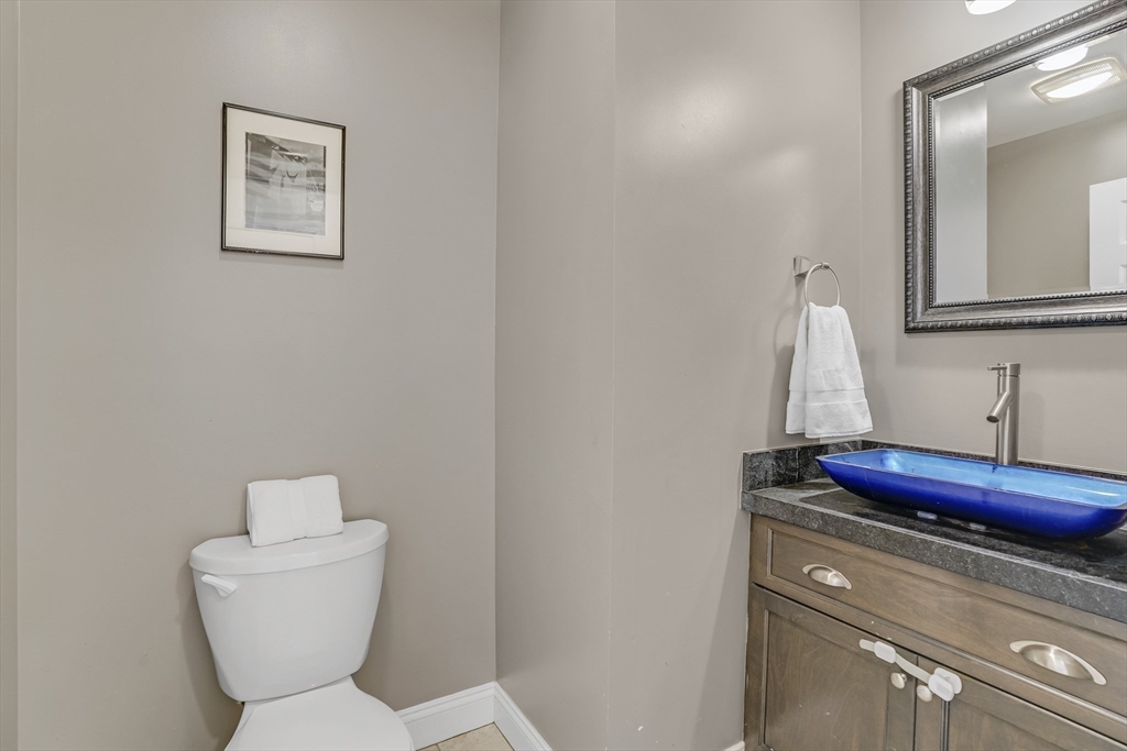 128-136 Spring Street Tisbury, MA 02568 - Photo 18 of 42 a bathroom with a toilet and sink