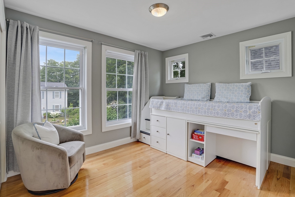 128-136 Spring Street Tisbury, MA 02568 - Photo 26 of 42 a bed room with a bed and a couch