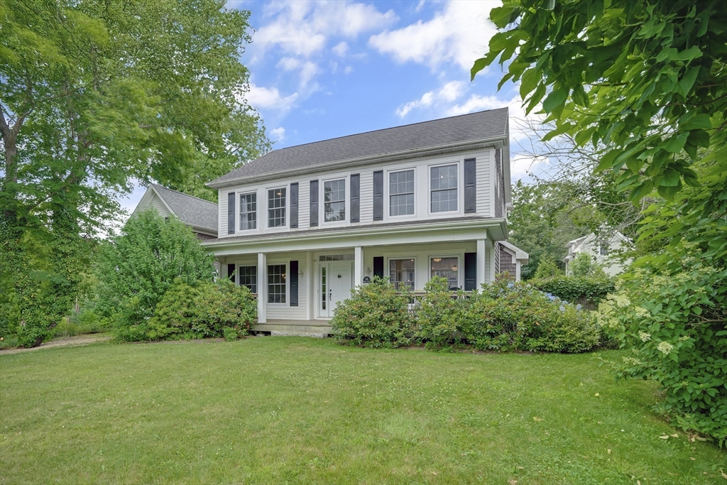 128-136 Spring Street Tisbury, MA 02568 - Photo 3 of 42 a front view of a house with a garden
