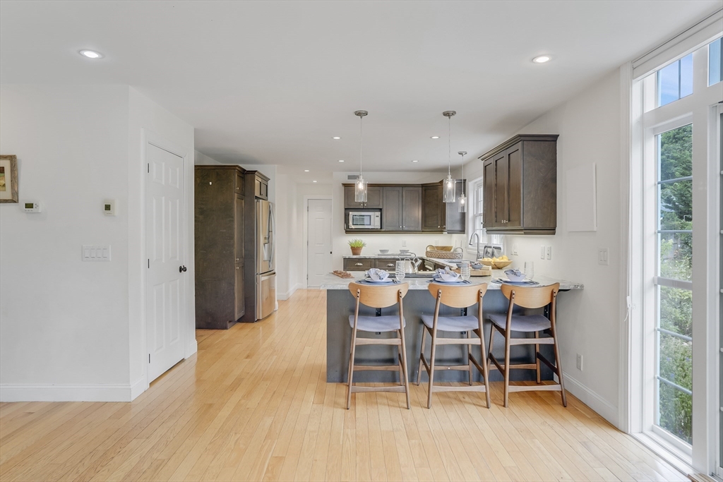 128-136 Spring Street Tisbury, MA 02568 - Photo 10 of 42 a view of a dining room with furniture window and wooden floor