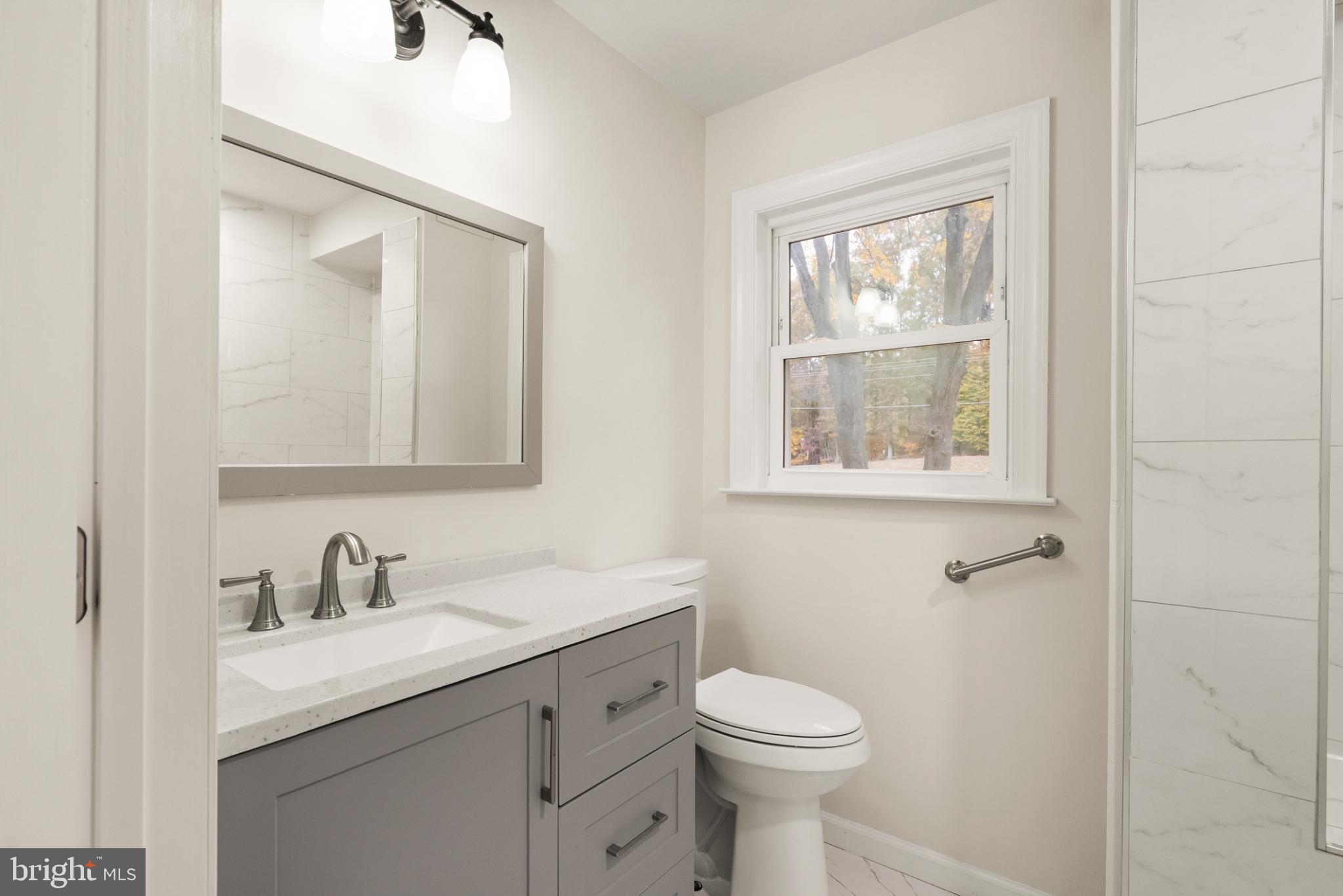 7075 Yates Ford Road Manassas, VA 20111 - Photo 24 of 54 Modern bathroom with natural light.