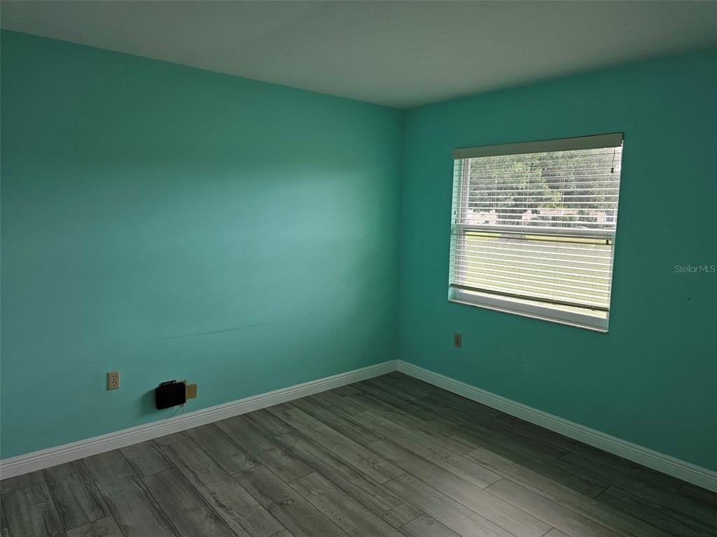 3304 Mcdill Road Bradenton, FL 34207 - Photo 14 of 23 a view of a room with wooden floor and a window