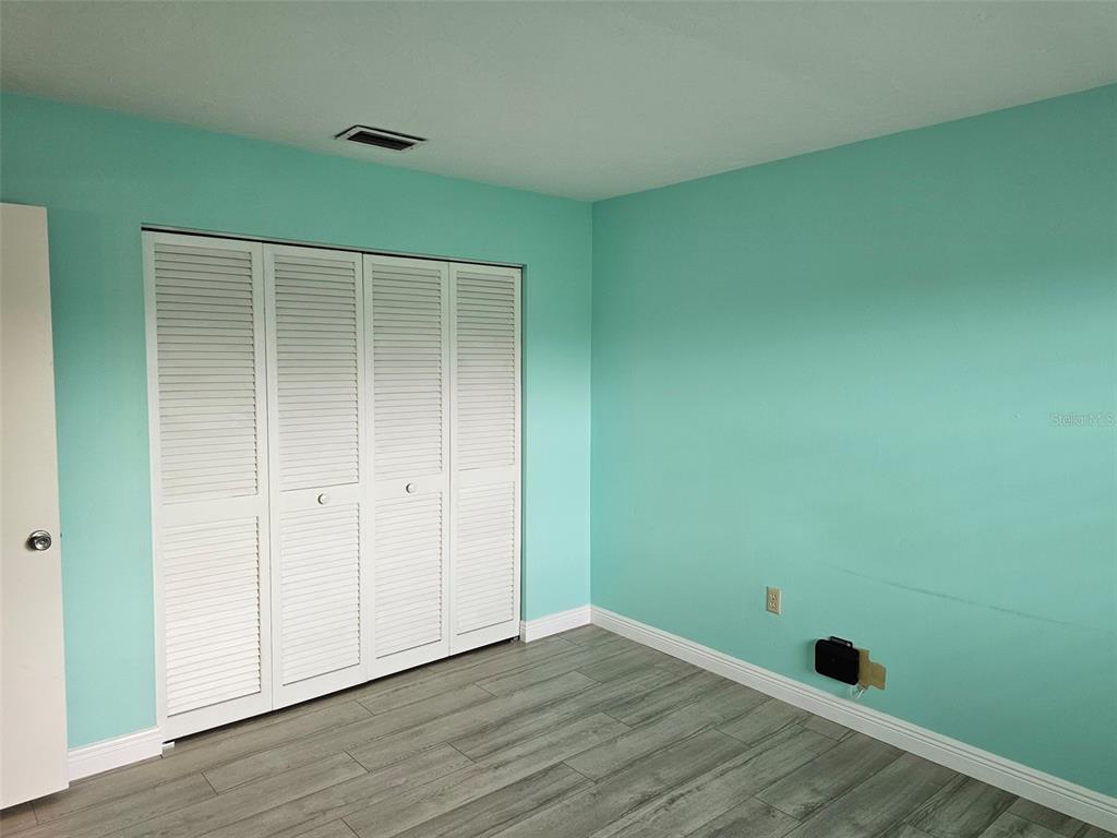 3304 Mcdill Road Bradenton, FL 34207 - Photo 15 of 23 a view of empty room with wooden floor