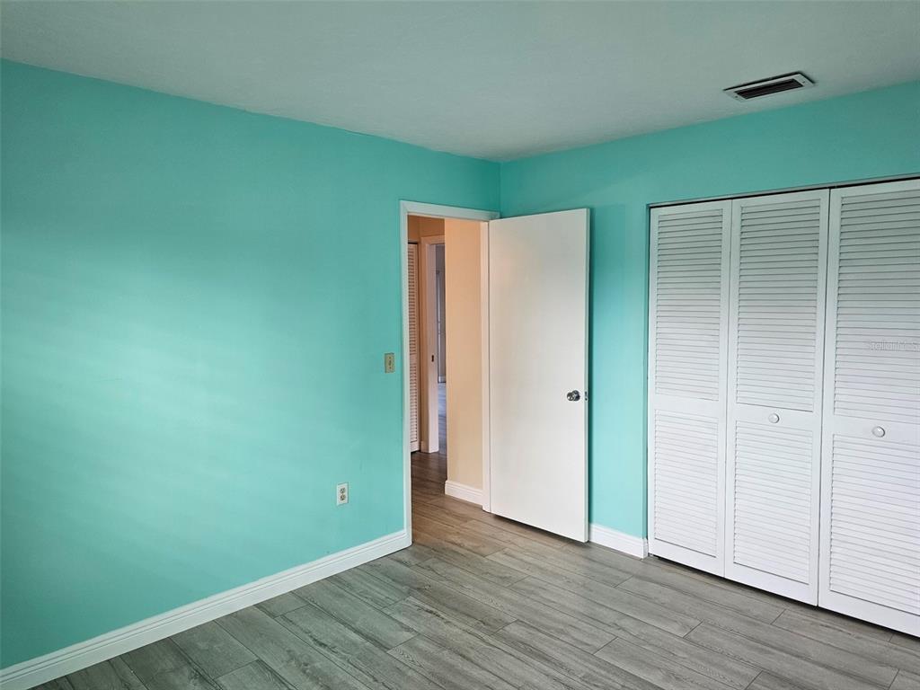 3304 Mcdill Road Bradenton, FL 34207 - Photo 16 of 23 a view of an empty room with wooden floor
