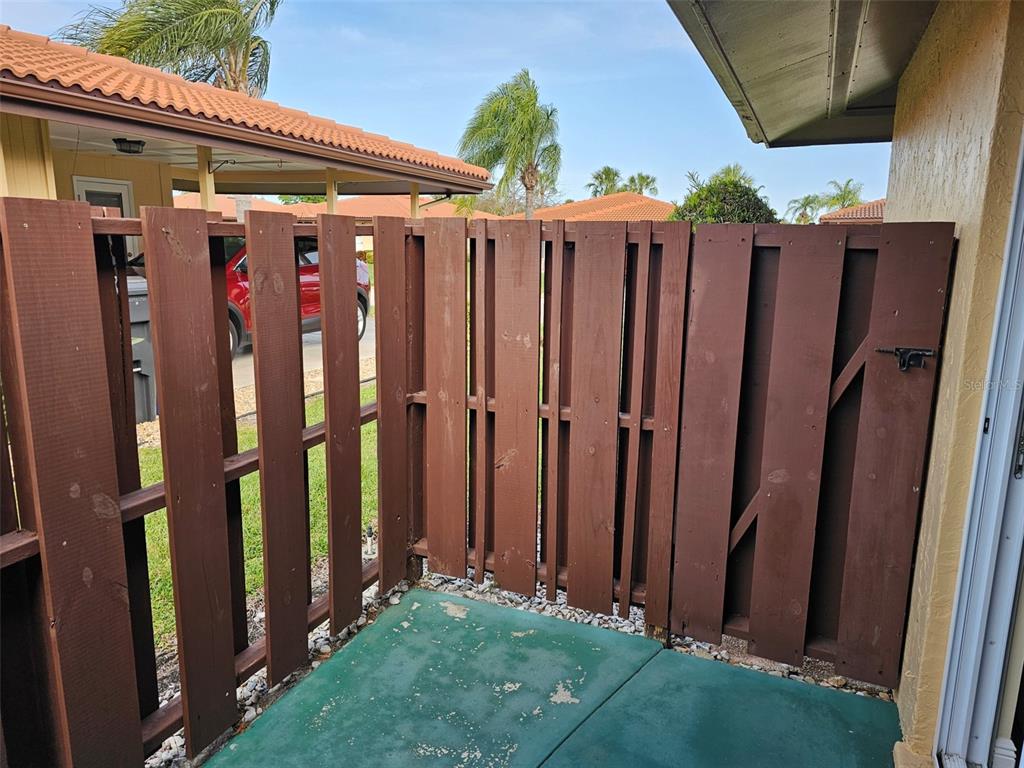 3304 Mcdill Road Bradenton, FL 34207 - Photo 19 of 23 a view of a door with a black and white fence