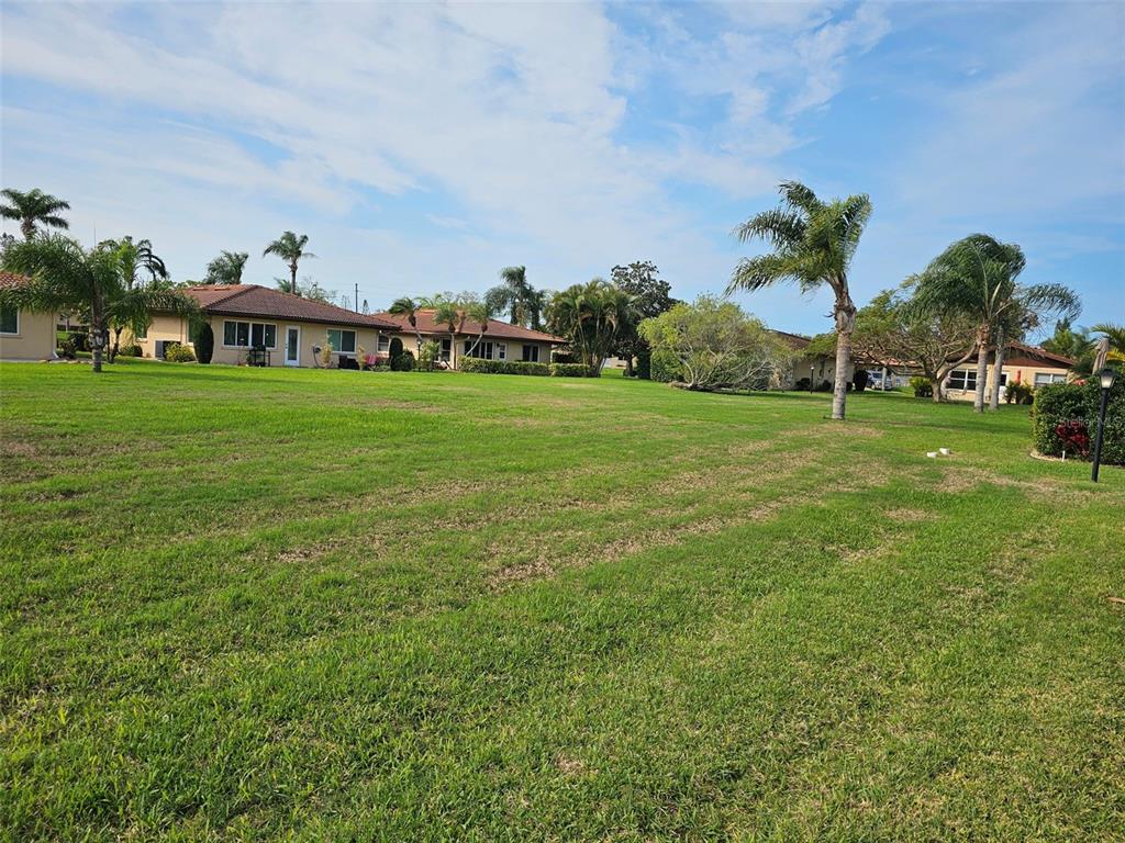 3304 Mcdill Road Bradenton, FL 34207 - Photo 20 of 23 a view of a big house with a big yard and large trees
