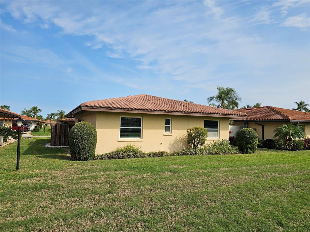 3304 Mcdill Road Bradenton, FL 34207 - Photo 22 of 23 a view of a house with yard and a garden