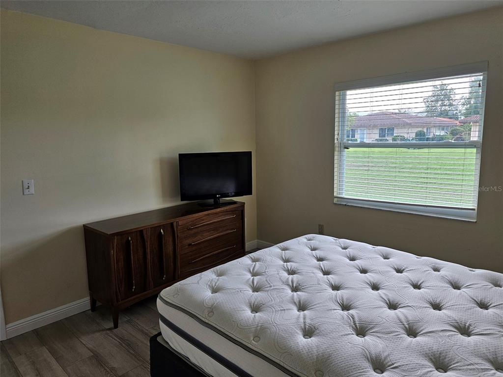 3304 Mcdill Road Bradenton, FL 34207 - Photo 10 of 23 a bedroom with a bed and flat screen tv