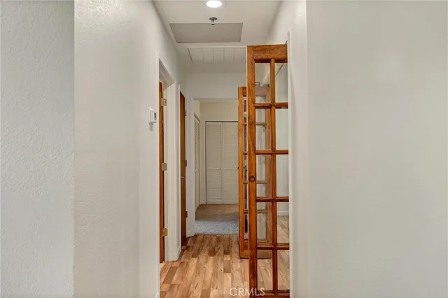 a view of hallway with wooden floor