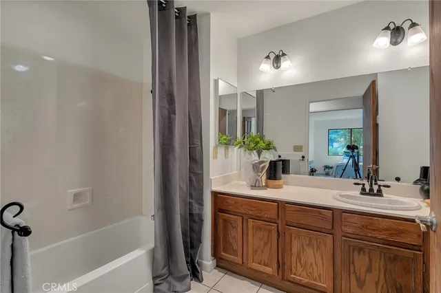 a bathroom with a double vanity sink and a bathtub