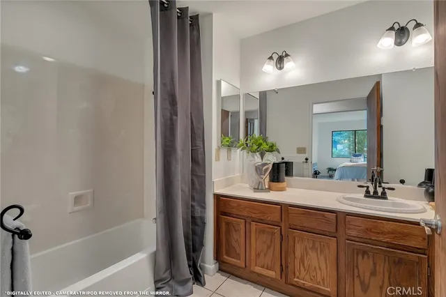 a bathroom with a double vanity sink and a mirror