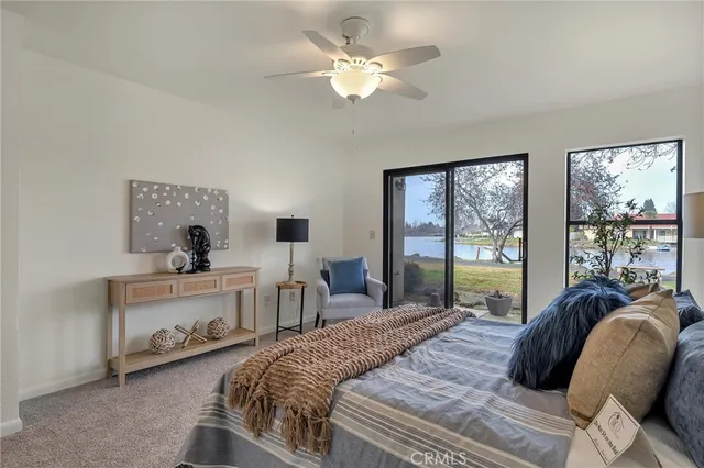 a bed room with a bed and a chandelier