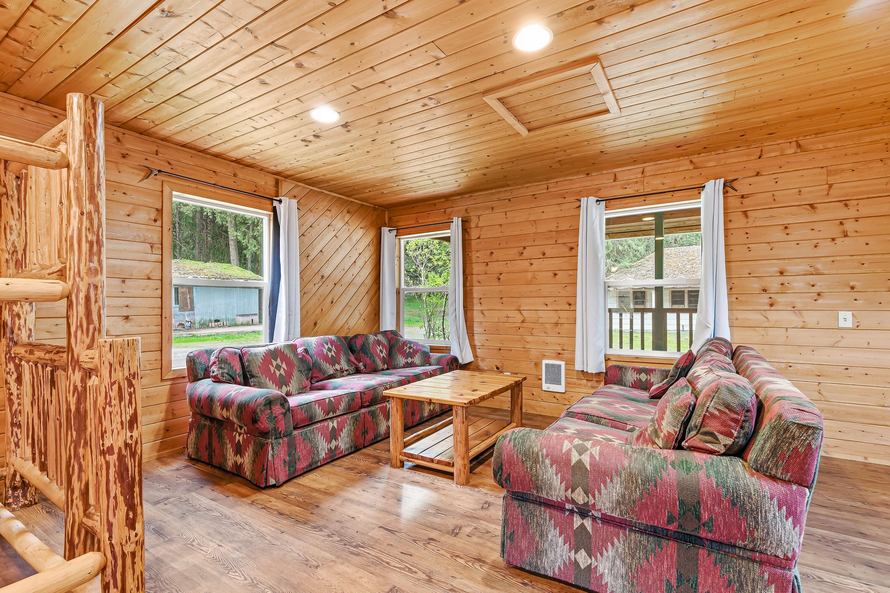 159 Bloom Road Wolf Creek, OR 97497 - Photo 8 of 38 a bedroom with furniture and a large window