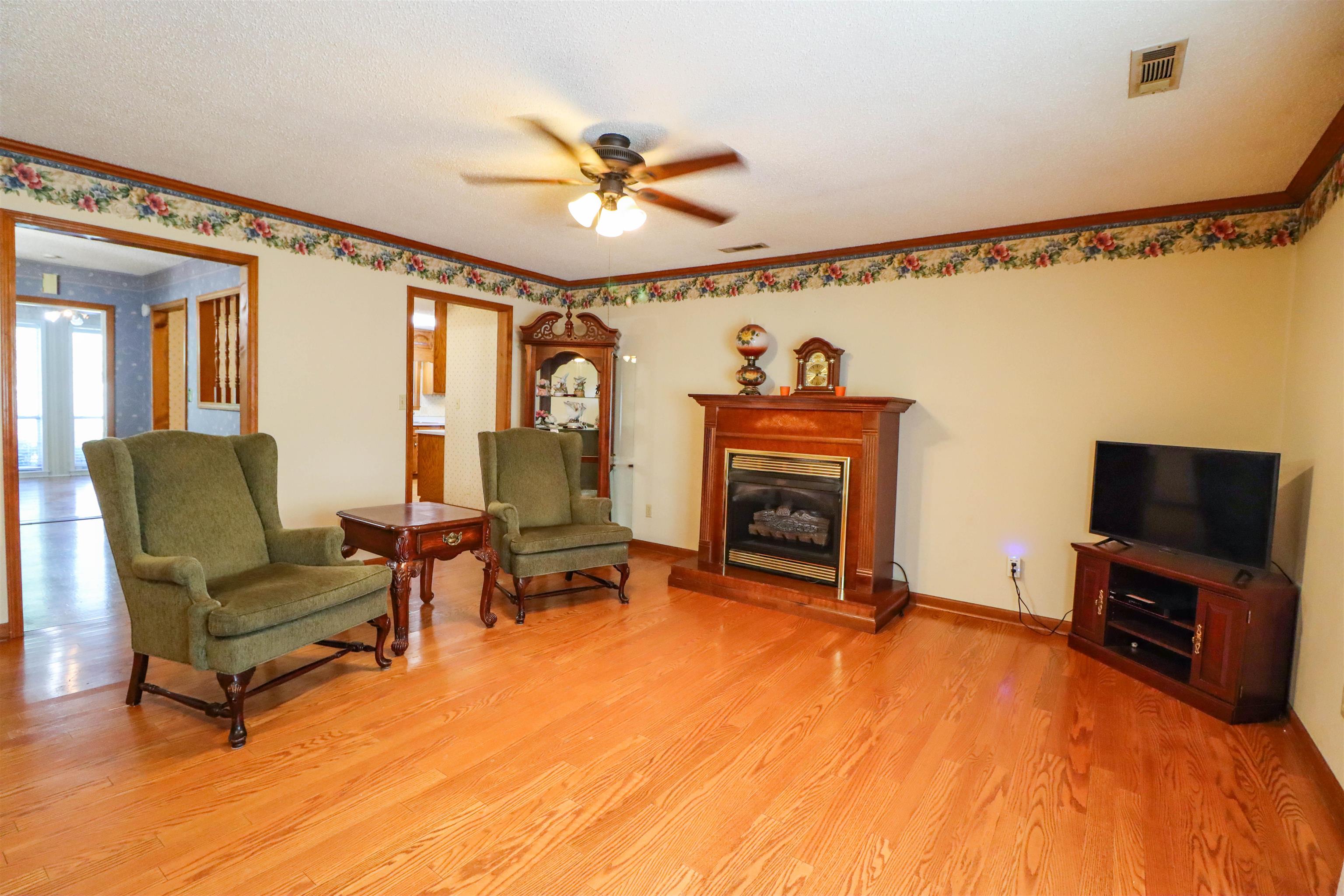 5551 Asbury Glimp Road Ripley, TN 38063 - Photo 15 of 28 a bedroom with furniture and a fireplace