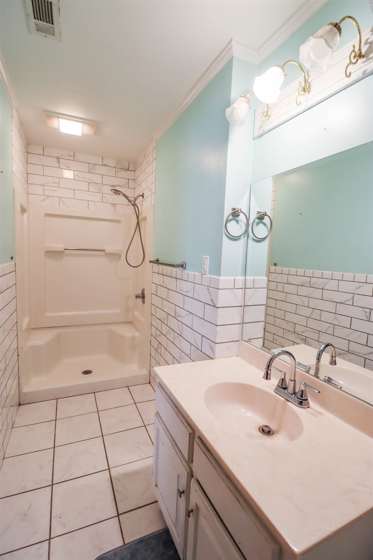 5551 Asbury Glimp Road Ripley, TN 38063 - Photo 18 of 28 a bathroom with a sink and a mirror