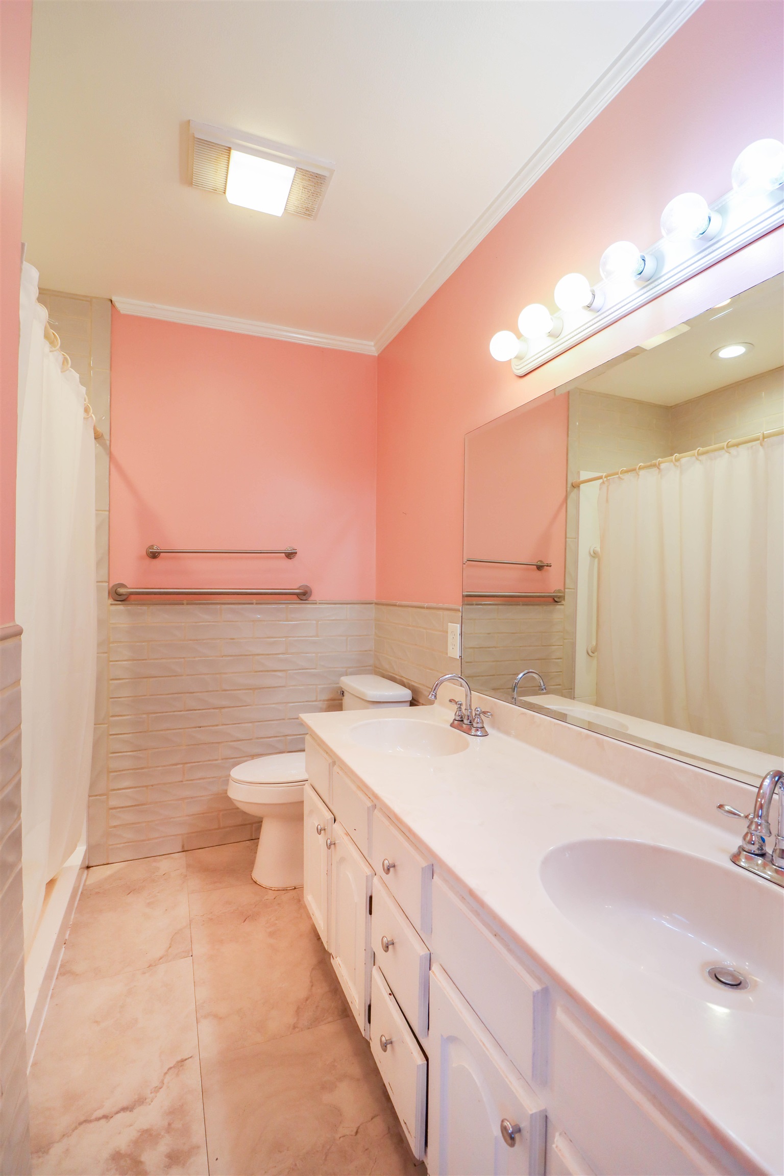 5551 Asbury Glimp Road Ripley, TN 38063 - Photo 23 of 28 a spacious bathroom with a sink a toilet and mirror