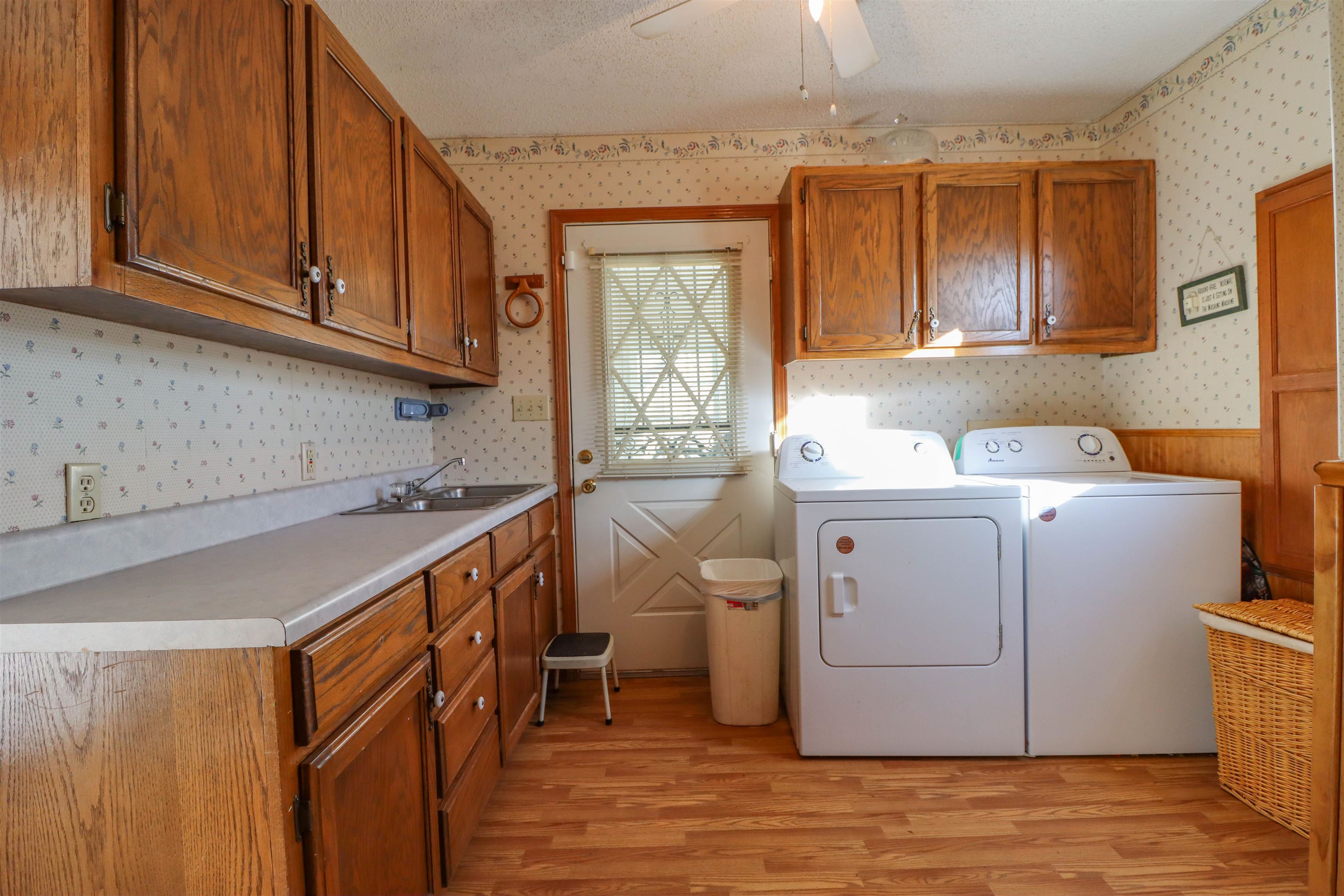 5551 Asbury Glimp Road Ripley, TN 38063 - Photo 8 of 28 a utility room with a sink washer and dryer