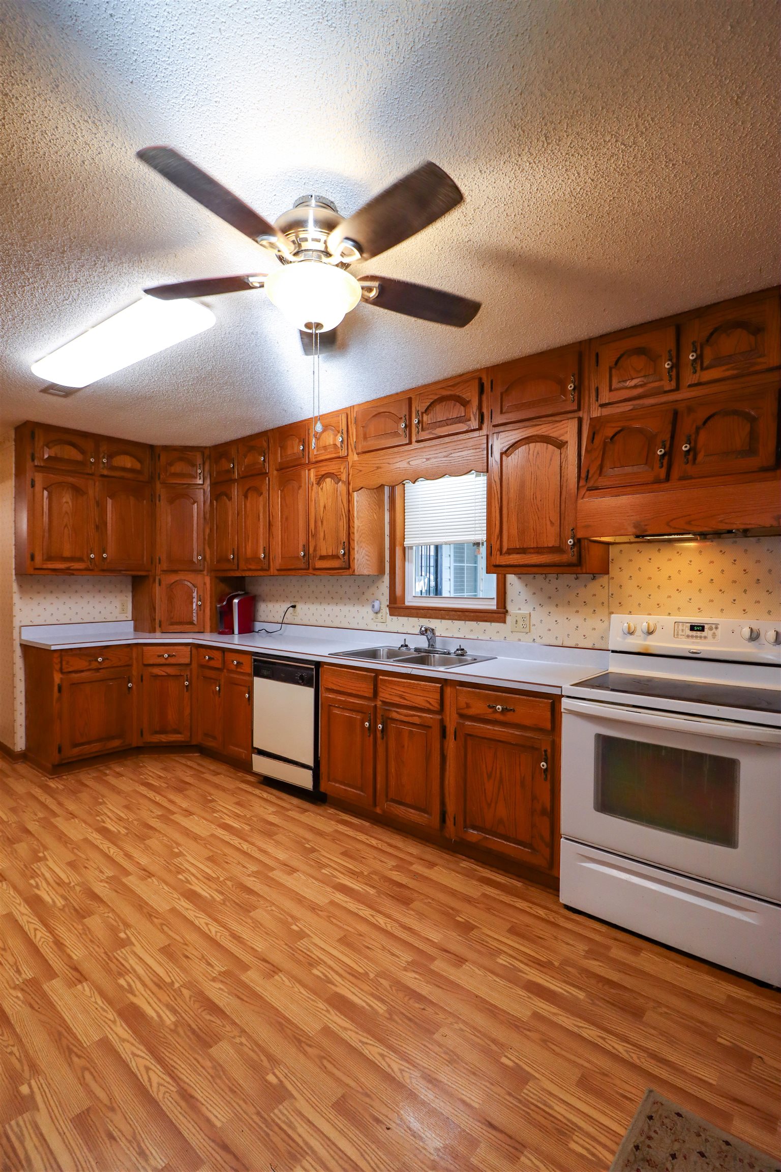 5551 Asbury Glimp Road Ripley, TN 38063 - Photo 9 of 28 a view of a kitchen with a sink and a stove top oven