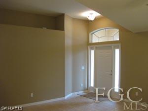 2817 13th Street Southwest Lehigh Acres, FL 33976 - Photo 3 of 9 a view of a livingroom with wooden floor