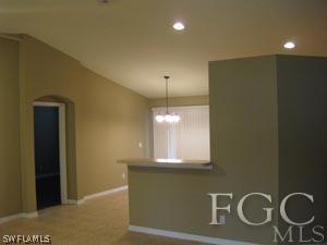 2817 13th Street Southwest Lehigh Acres, FL 33976 - Photo 5 of 9 a bathroom with a sink and a mirror