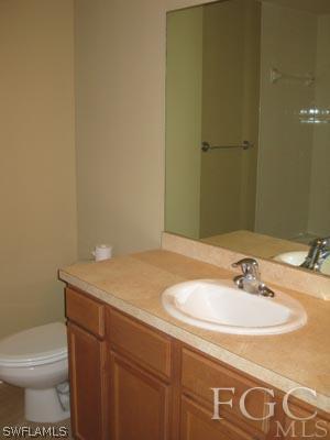 2817 13th Street Southwest Lehigh Acres, FL 33976 - Photo 9 of 9 a bathroom with a sink and a toilet