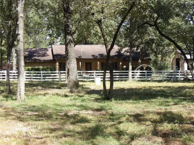 a front view of a building with garden