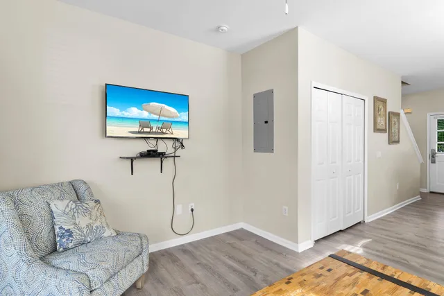 a living room with furniture and a potted plant