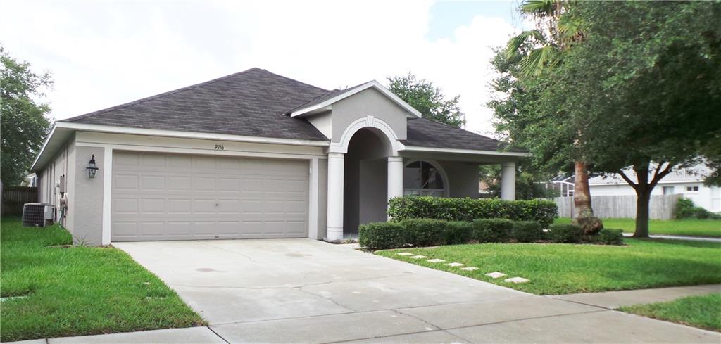 9716 Laurel Ledge Drive Riverview, FL 33569 - Photo 1 of 1 a front view of a house with a yard and garage