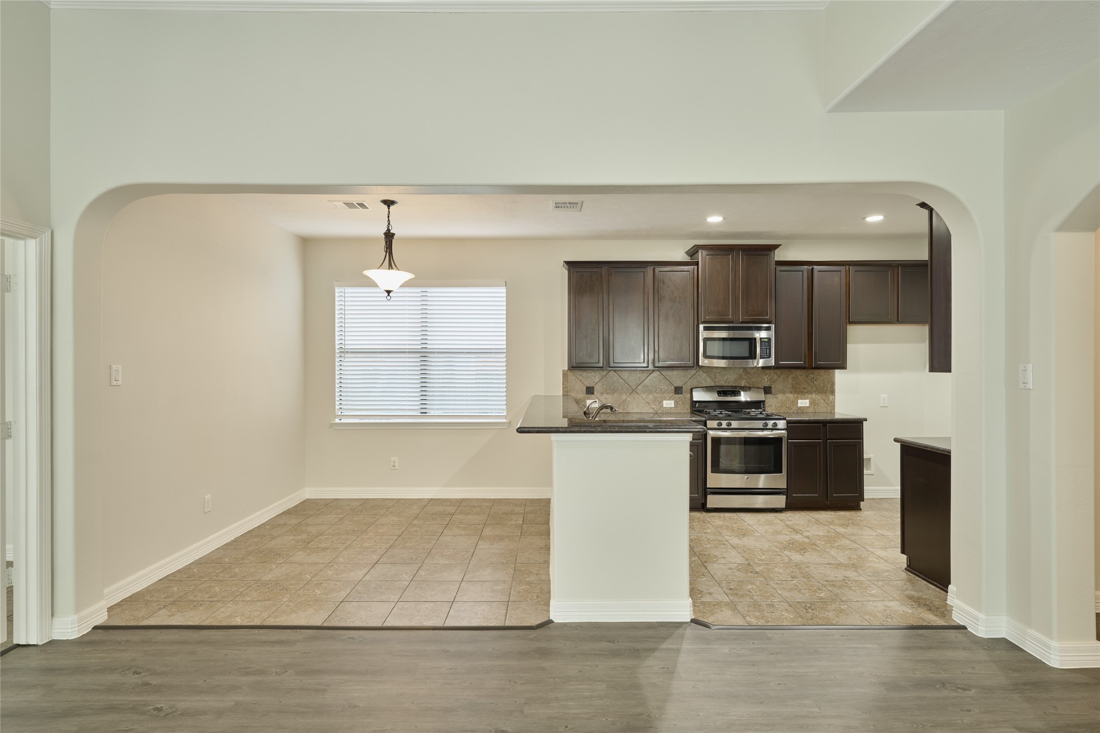630 Aulia Lane Spring, TX 77386 - Photo 15 of 48 Kitchen w/ Breakfast Bar + Dining Area