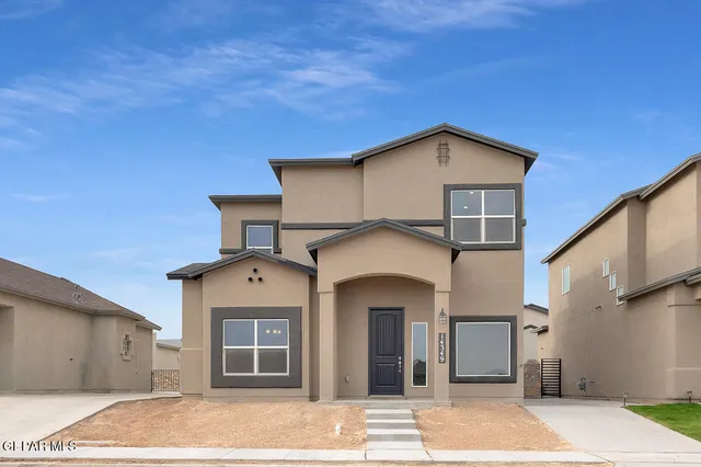 a front view of a house with a garage
