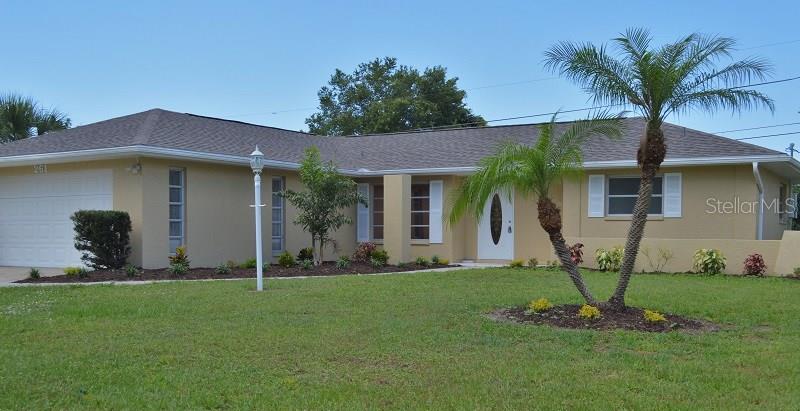 261 Manor Road Venice, FL 34293 - Photo 1 of 1 a view of a house with backyard and a tree