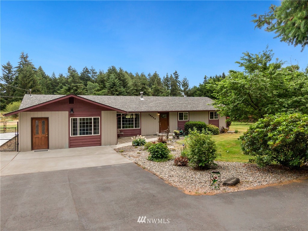 19206 Loganberry Street Southwest Rochester, WA 98579 - Photo 2 of 39 a view of a house with a yard and plant