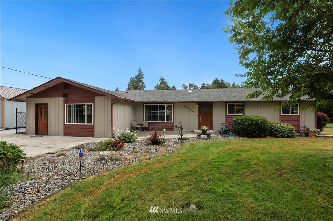 19206 Loganberry Street Southwest Rochester, WA 98579 - Photo 3 of 39 a front view of house with yard and seating area
