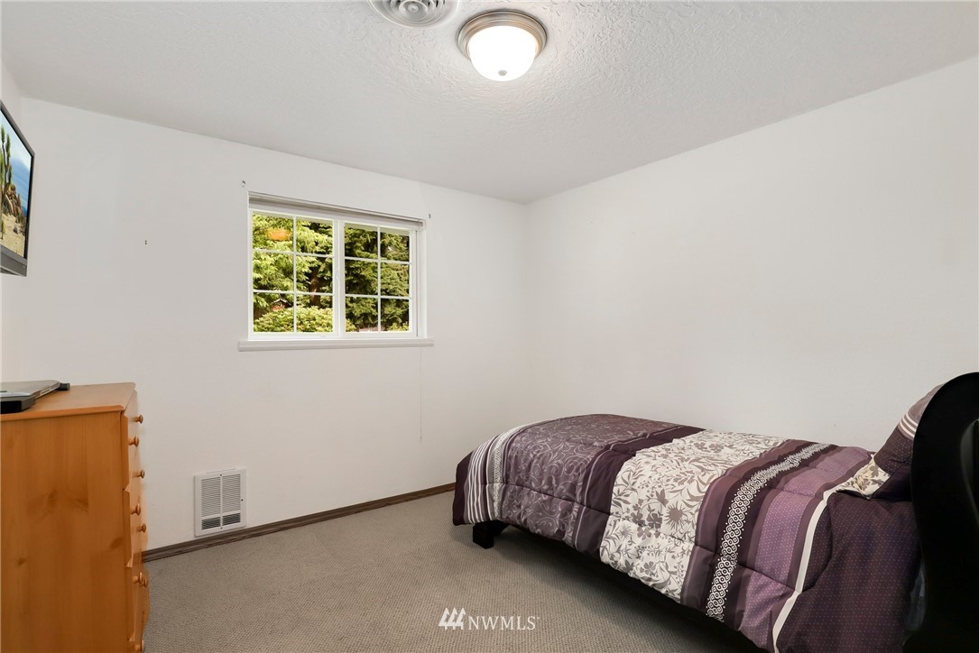 19206 Loganberry Street Southwest Rochester, WA 98579 - Photo 25 of 39 a bedroom with a bed and a window