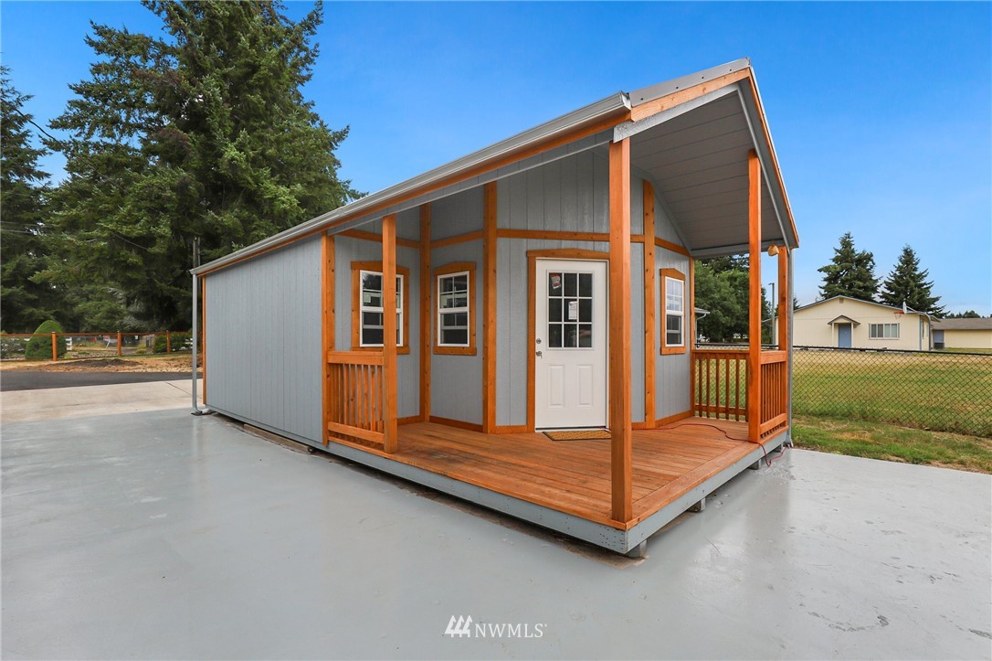 19206 Loganberry Street Southwest Rochester, WA 98579 - Photo 28 of 39 a view of backyard with deck and a garden