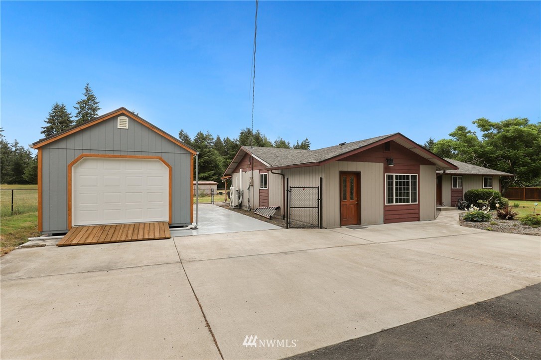 19206 Loganberry Street Southwest Rochester, WA 98579 - Photo 4 of 39 a front view of a house with a yard