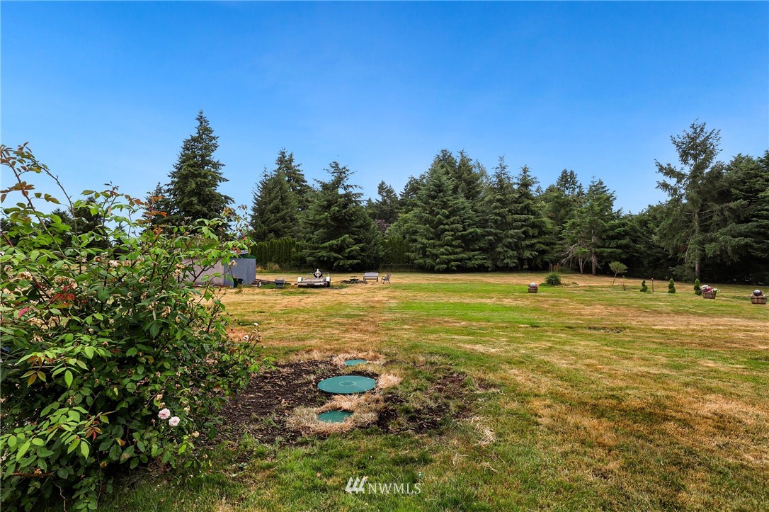 19206 Loganberry Street Southwest Rochester, WA 98579 - Photo 32 of 39 a view of a large swimming pool with an ocean view