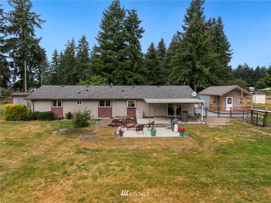 19206 Loganberry Street Southwest Rochester, WA 98579 - Photo 36 of 39 a front view of a house with garden